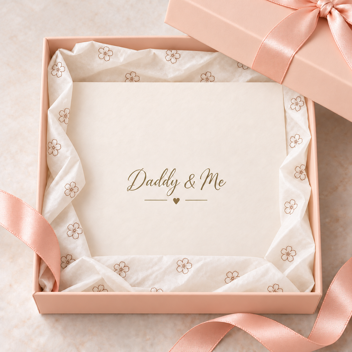 Blush pink gift box with ribbon and tissue paper for the pregnancy reveal box